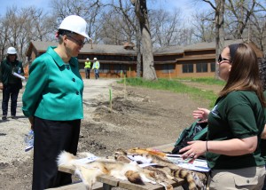 Cook County Board President Toni Preckwinkle speaks with a program leader at Camp Reinberg in Palatine, one of five county sites that will be open for public camping this summer. (Photo courtesy of Forest Preserve District of Cook County)