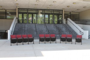 These seats, which are set up on the steps of the old Maine North High School that was used for filming and is now a state of Illinois office building, will be up for auction throughout June. Photo from Illinois Department of Central Management Services
