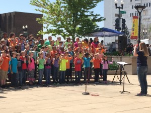 Under the direction of Rebecca Johnson, third grade music students from Pepper Ridge Elementary school in Bloomington sing selections from the musical “Heroes All” on May 1 as part of the Arts in Education Spring Celebration at the Peoria County Courthouse.  Photo by Amy Morys.