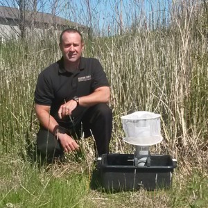 Eric Lane of the Woodford County Health Department with a mosquito trap.