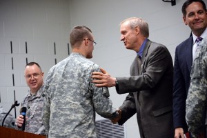 Illinois Governor Bruce Rauner and State Representative Tim Butler shake the hands of Soldiers at a ceremony for the 139th Mobile Public Affairs Detachment on June 7 at Camp Lincoln, Springfield Illinois. The unit is deploying to Guantanamo Bay, Cuba later this month. (U.S. Army National Guard Photo by Staff Sgt. Robert R. Adams, Illinois National Guard Public Affairs)
