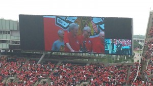 The giant video screen helped attendees get a close-up view of the ceremony, emceed by broadcaster Pat Foley. Photo by Mike Rubino