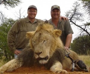 Walter Palmer (left) poses with his trophy, Cecil the lion.  