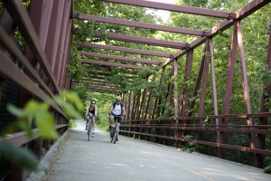 Bikers on bridge over Higgins Rd at Busse Woods Preserve, June 2012.