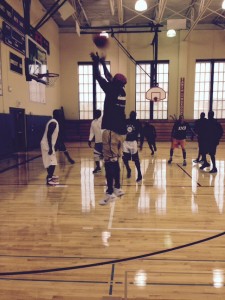 : Former NBA star Kendall Gill takes a jumps shot during a pickup game at the University of Chicago Lab School. Gill and other top area players get together several times per week for pickup games at the school. (Photo courtesy of Ian Mahoney)