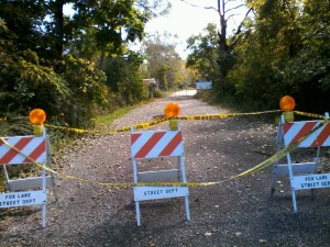 Barricades block the section of Honing Road, where Fox Lake police Lt. Charles Glinieiwcz was found shot Sept. 1, and later died at the scene. Members of Lake County's major crimes task force and the coroner's office visited the site Sept. 22.