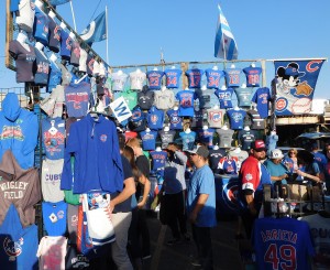 Get your Cubs stuff right here. A vendor offers a variety of shirts, hats, flags and other Cubs keepsakes outside the Wrigley Field bleachers prior to a National League Division Series against the Cardinals. (Chronicle photo).