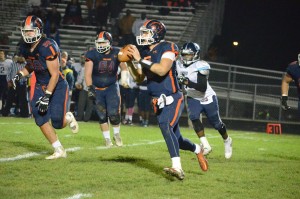 Oswego High School quarterback Steven Frank getting off a pass against Belleville East Oct.30. (Photo by Al Benson)