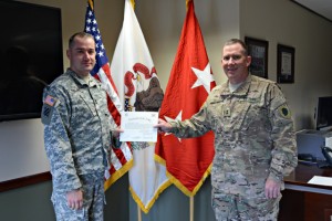 Maj. Gen. Richard J. Hayes Jr. (right), the Adjutant General of the Illinois National Guard presents Master Sgt. Christopher Winling of Lake Villa with Joint Force Headquarters in Springfield, Illinois, a certificate after Winling recited the oath of office, as the Illinois National Guard (ILNG) Assistant Inspector General for the Office of Inspector General Oct. 8 during a ceremony at Camp Lincoln in Springfield, Illinois. (U.S. Army National Guard photo by Staff Sgt. Robert R. Adams, Illinois National Guard Public Affairs Office)