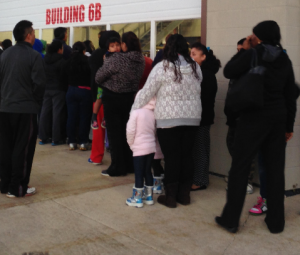 People line up to get their turn to select coats. (Photo by Adela Crandell Durkee/for Chronicle Media)