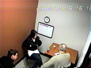 Detectives Charles Curran (left) and George Filenko flank Melissa Calusinski, during a Jan. 16, 2009 nine-hour interrogation at the Lake Zurich police station. (Photo taken from interrogation tapes)