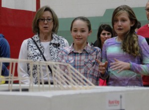  Members of Oswego’s  Thompson Junior High School team watch as their entry is tested during the Fourth Annual 4-H Bridge Busting Competition on Saturday, Jan. 9.  The team finished second for the Aesthetics Awards in the middle school division. (Photo courtesy of University of Illinois Extension) 