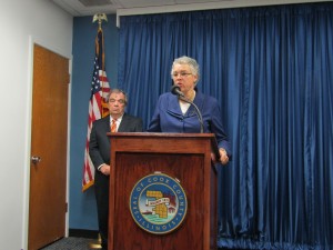 Cook County Board President Toni Preckwinkle talks during a Feb. 10 press conference about the $66 million that the state owes the county for program costs and rent. Looking on is Commissioner John Daley, chairman of the county's Finance Committee. (Photo by Kevin Beese/for Chronicle Media)