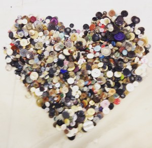 Peoria Academy eighth-grader Liam Janda fashioned buttons from the Peoria Holocaust Museum into this heart shape after feeling moved by each one that passed through his hands. Janda and a group of classmates helped sort buttons for the memorial, which is being refurbished. (Photo courtesy of Jen Smith)