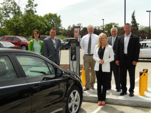 DuPage County Board members (from left) Pete DiCianni, Amy Grant, Jim Healy, Tonia Khouri, Sam Tornatore, Sean Noonan and Grant Eckhoff at the electric vehicle charging station at  421 N. County Farm Road, Wheaton. (Photo courtesy DuPage County) 