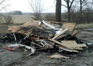 An entire roof was dumped at the Rutland Forest Preserve in Hampshire on Feb. 3. Kane County Forest Preserve officials are seeking the public’s help to curb illegal dumping. 