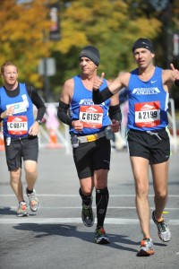 Hector Nunez, chief operating officer of Imerman Angels, runs the Chicago Marathon in 2012 with his doctor after the physician promised to run with Nunez if he competed in the marathon. (Photo courtesy of Imerman Angels)
