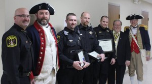 Pictured from left are Kendall County Sheriff Dwight A. Baird, Deputy Jason Larsen, Deputy Zach Tongate, Deputy Tyler Johnson, and members of the National Society of the Sons of the American Revolution. (Photo courtesy Kendall Co. Sheriff’s Office) 