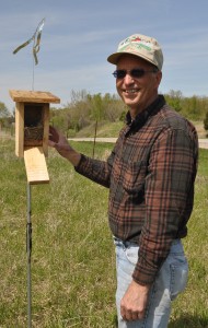  Herb Unkirch, a volunteer at Wildlife Prairie Park, checks a bluebird box at the natural habitat park located 10 miles west of downtown Peoria. The park depends on volunteers and is taking applications from anyone age 13 and up who’d like to help. (Photo courtesy of Wildlife Prairie Park) 