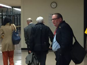 Board members Theresa McKelvey, Dan Adams, Kevin McDermott and Brian Cross walk out of a Proviso Township High School D209 meeting after failing to shorten the president's term.