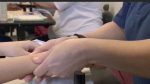 Inmates learn how to give manicures at the Logan Correctional Center cosmetology school. (Courtesy: Illinois Department of Corrections