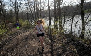 Runner Jessica Mills (532) and her dad Jim (531) finish the last leg of the race along the Fox River during the Saw Wee Kee Spring Trail Challenge at Saw Wee Kee Park in Oswego on Saturday, April 16. (Photo by Steven Buyansky/for Chronicle Media)