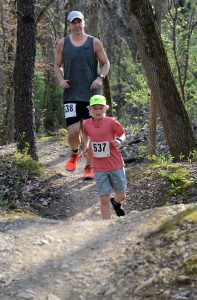 Parker Wasson (537) drops into a dip followed by his dad Greg (538) during the Saw Wee Kee Spring Trail Challenge at Saw Wee Kee Park in Oswego on Saturday, April 16, 2016. Photo by Steven Buyansky