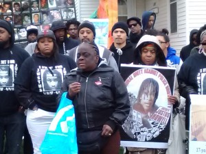 Juanita Ferguson, mother of Malcolm Ferguson, addresses the crowd flanked by LaToya Howell (left), and Alice Howell, Justus' mother and grandmother respectively.