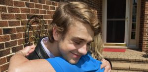 Ryan Goldsher, 19, of Northbrook and a 2015 Glenbrook North High School graduate, gets a hug from his mother Linda Goldsher out front of his home in Northbrook May 18, 2016. Goldsher won $10,000 for his celebrity impressions on the USA Network show “First Impressions,” a competition show featuring comedian Dana Carvey.