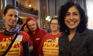 State Rep. Lisa Hernandez poses with domestic workers in the Illinois statehouse in Springfield in April. (Photo courtesy of Domesticworkers.org) 