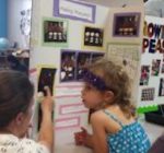 Young scientists at Goddard School display their work