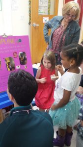 Colbie Livesay, 5, explains her science fair project about velocity and friction to the judges during The Goddard School of Aurora's first science fair for Pre-K and Kindergarten students on May 12. (Photo by Erika Wurst/for Chronicle Media) 