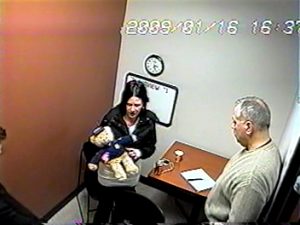 Melissa Calusinski, and Det. George Filenko, later the commander for the Lake County Major Crimes Task Force, in a photo capture from the tape of her interrogation, which lasted more than nine hours.