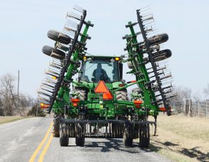 Motorists are advised to be cautious when following slower-moving and larger farm machinery moving on local roads. (University of Missouri Extension photo) 