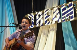Alex Harris, 12, of Northbrook and a sixth-grader, performs during the fifth annual Success Assembly May 25, 2016 with a theme of “Dream.” (Photo by Karie Luc for Chronicle Media)