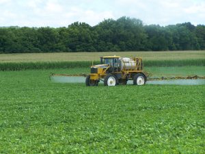 An applicator sprays herbicide on soybeans in northern Peoria County on Friday, July 1. (Photo by Tim Alexander) 
