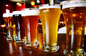 Various beers are lined up on a bar. Right now, there are no happy hours in Downers Grove. That could change if the Village Council considers state-sanctioned discounted liquor sales at is Aug. 2 meeting.
