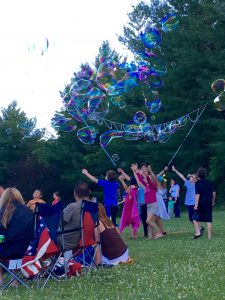 Children play with bubbles at the Oakwood Hills Concert in the Park, where the Crystal Lake Community Band performed, June 28. (Photo Courtesy Adela Crandell Durkee)