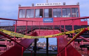 : Panoramic view of East Aurora High School’s Roy E. Davis Field.  Lower right, entry to passages at the crumbling stadium are discouraged by yellow cautionary tape. (Photo by Jack McCarthy / Chronicle Media)