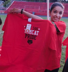 Tee-shirts proclaiming East Side Tomcat pride were so popular that they sold out at last week’s closing ceremony at Roy E. Davis Field. (Photo by Jack McCarthy / Chronicle Media) 