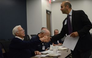 Aurora resident Ed Young, left, was honored last month for serving 22 years as a volunteer visitor greeter at Dreyer Medical Clinic in Aurora. Dr. Chintan Mistry, right, Dreyer chief medical director, presented recognition certificates. Young was among 26 volunteers s week honored at a recognition breakfast at Dreyer’s new Sequoia Clinic which opened this week in Aurora. (Al Benson photo).