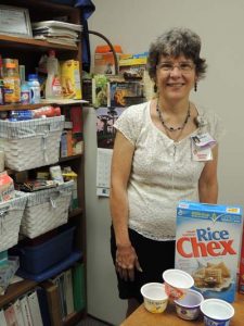  Shirley Poole, a clinical dietitian at SwedishAmerican Hospital poses with some of the foods that she uses in  educating patients on a healthy diet.  (Photo by Lynne Conner/for Chronicle Media)