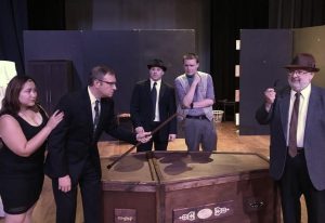 Members of the Nitsch Theatre Arts company (from left) Briana Vior-Van Hoorn, Dr. Chris Hughes, Kyle King, Kyle Redmon, and John Johnson rehearse a scene from “Loot”  which will be performed July 8-10 at Eureka College’s Pritchard Theatre. (Photo courtesy Nitsch Theatre Arts) 