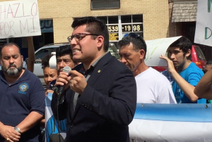 Ald. Carlos Ramirez-Rosa (35th Ward)  speaks to demonstrators at a protest supporting immigrant day laborers in Chicago. (Chronicle Media) 