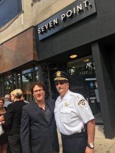 Brad Zerman poses with Oak Park’s future police chief Anthony Ambrose in front of Seven Point medical cannabis dispensary Aug. 19. (Courtesy Brad Zerman). 