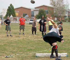 A kilt-wearing competitor throws a stone during the athletic games at last year’s Erin Feis. The Springfield-based Ancient Athletics group will host an official Highland Games competition at this year’s festival on Saturday, Aug. 27, and Sunday, Aug. 28. (Photo by Denny Sievers courtesy of Erin Feis)