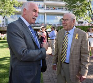  From right to left, Capt. James Lovell of Lake Forest and Apollo 13 astronaut, talks with Chicago Blackhawks Coach Joel Quenneville of Hinsdale before the Arlington Million win at Arlington International racecourse in Arlington Heights on Aug. 13, 2016. . (Photo by Karie Angell Luc/ for Chronicle Media)