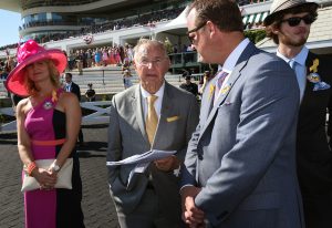 Dick Duchossois, Arlington Park owner of Barrington Hills (center) awaits the Arlington Million at Arlington International racecourse in Arlington Heights on Aug. 13, 2016. On his left is Michelle Mudd of Louisville, Ky., and on her right is her husband Bill Mudd, president and CEO of Churchill Downs. (Photo by Karie Angell Luc/ for Chronicle Media)
