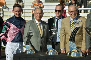 From left, Jockey Daniel Tudhope poses with (second from left) Dick Duchossois, Arlington Park owner of Barrington Hills and Capt. James Lovell (far right) of Lake Forest after Tudhope’s Arlington Million win at Arlington International racecourse in Arlington Heights on Aug. 13, 2016. (Photo by Karie Angell Luc/ for Chronicle Media)