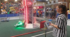 A judge awards points and watches for infractions during the July 30 Rock River Off-Season robotics competition at Rock Valley College.